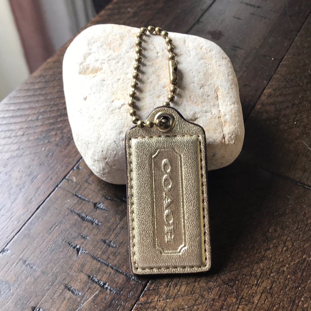 Gold lether coach charm